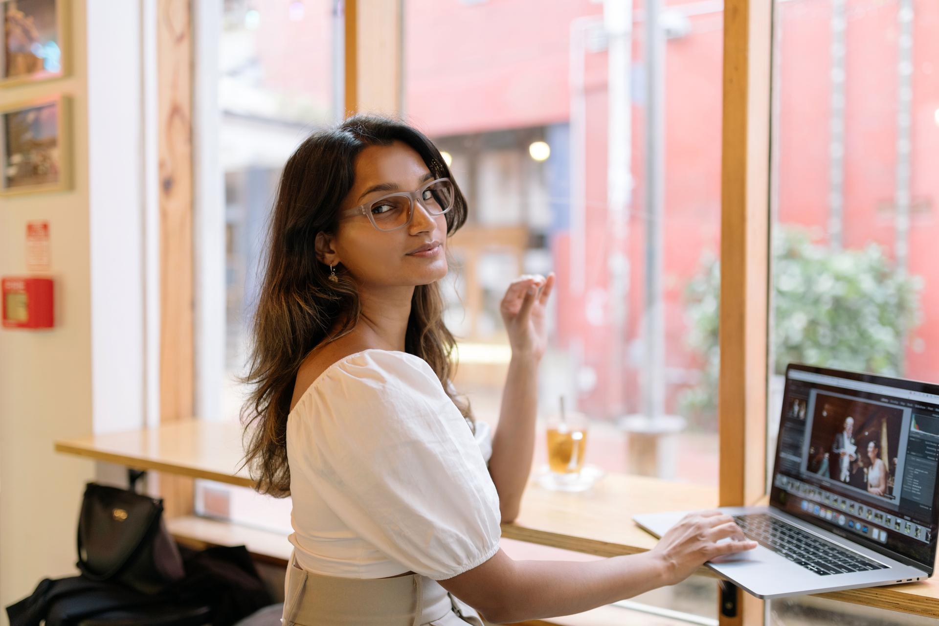 Dresden Vision Australia customer wearing clear screen-use glasses while working on a laptop, showing comfortable eyewear for long digital tasks.