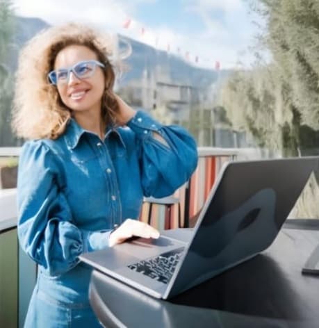 With a radiant smile, this woman showcases her lightweight and durable Dresden Vision Canada glasses, proving that sustainable eyewear fits seamlessly into a professional lifestyle.