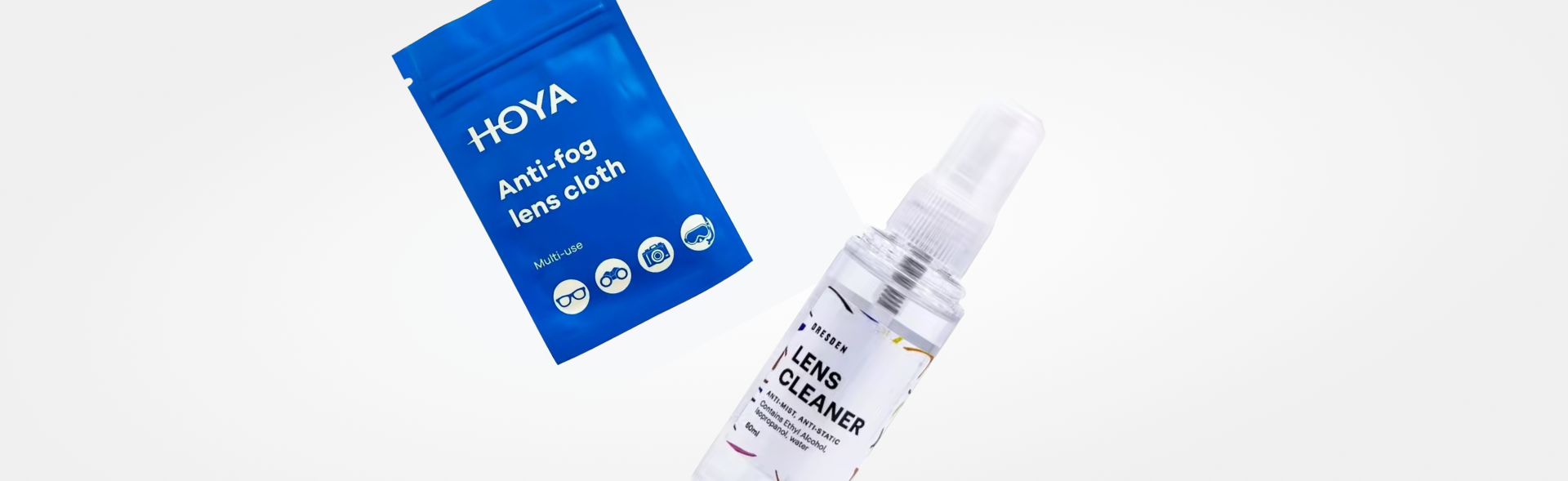 Two Dresden Vision lens care products: a blue package of 'HOYA Anti-fog lens cloth' and a clear spray bottle labeled 'LENS CLEANER,' set against a white background.