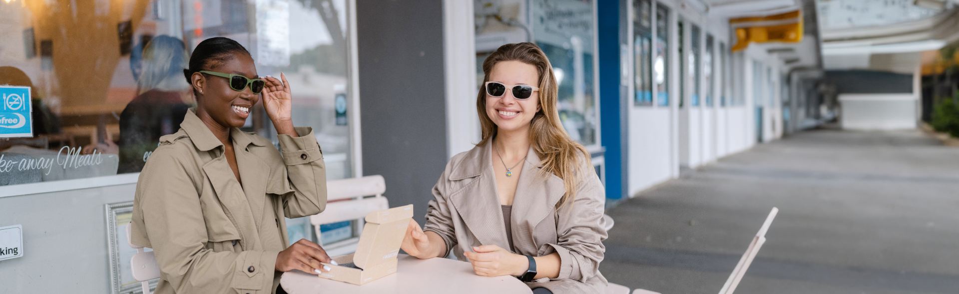 Two women smiling outdoors and wearing stylish women's sunglasses from Dresden Vision Australia, showcasing eco-friendly eyewear options.